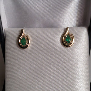 Oval Cut Emerald Earrings with Diamonds