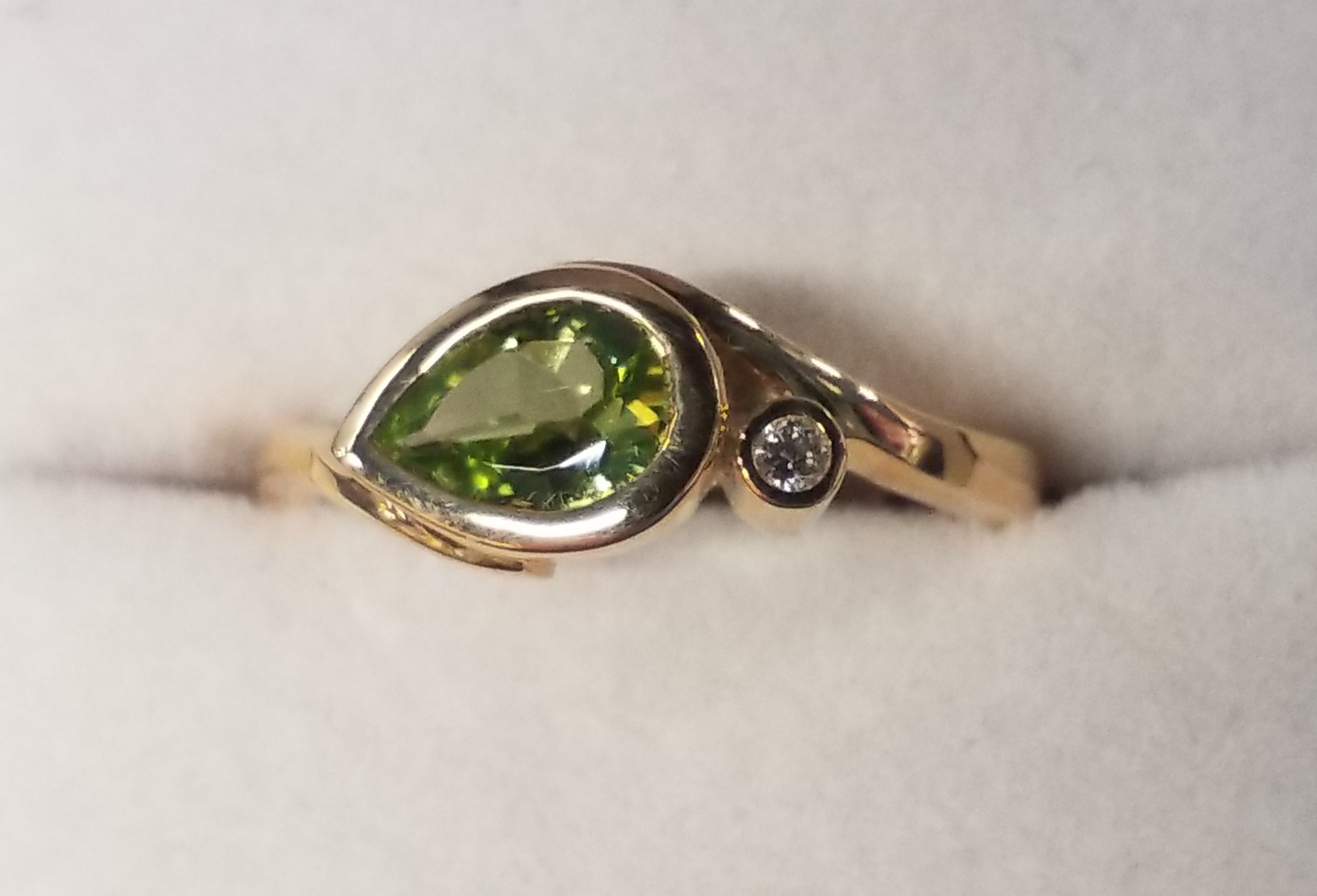 Pear Shape Cut Peridot Ring with Diamond Accents