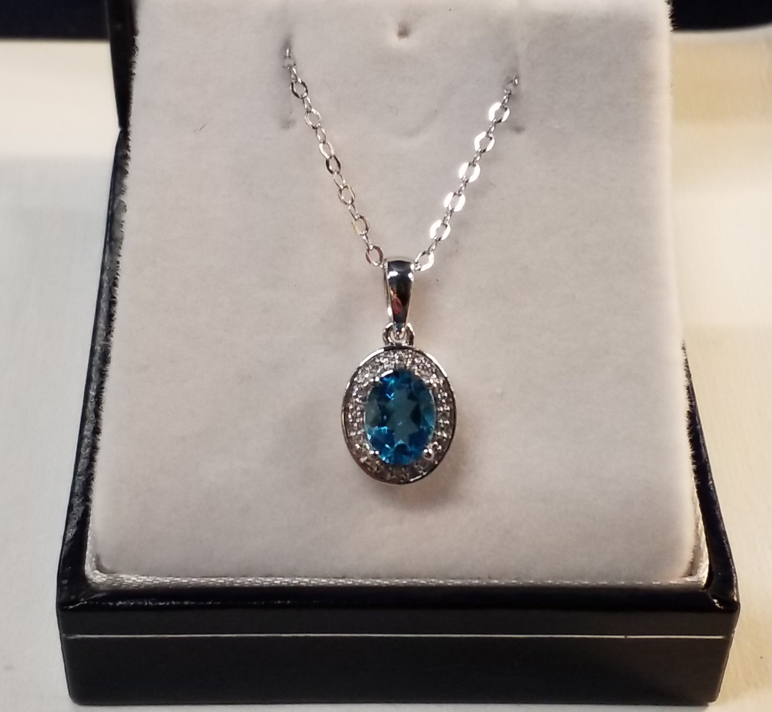 Oval Cut Blue Topaz Pendant with Diamond Accents