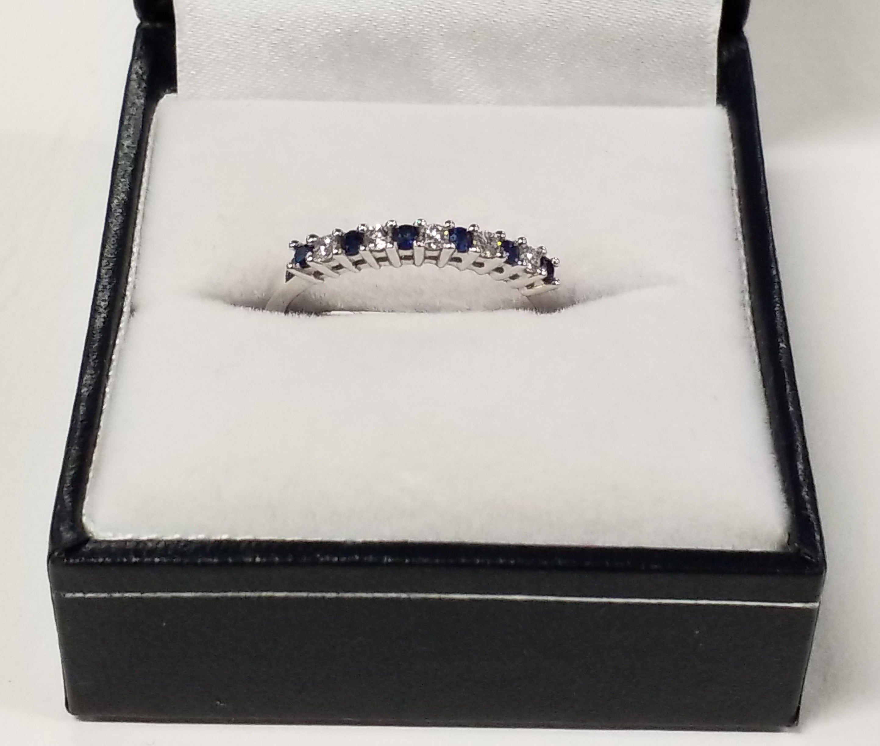 Six Round Cut Blue Sapphire and Diamond Ring