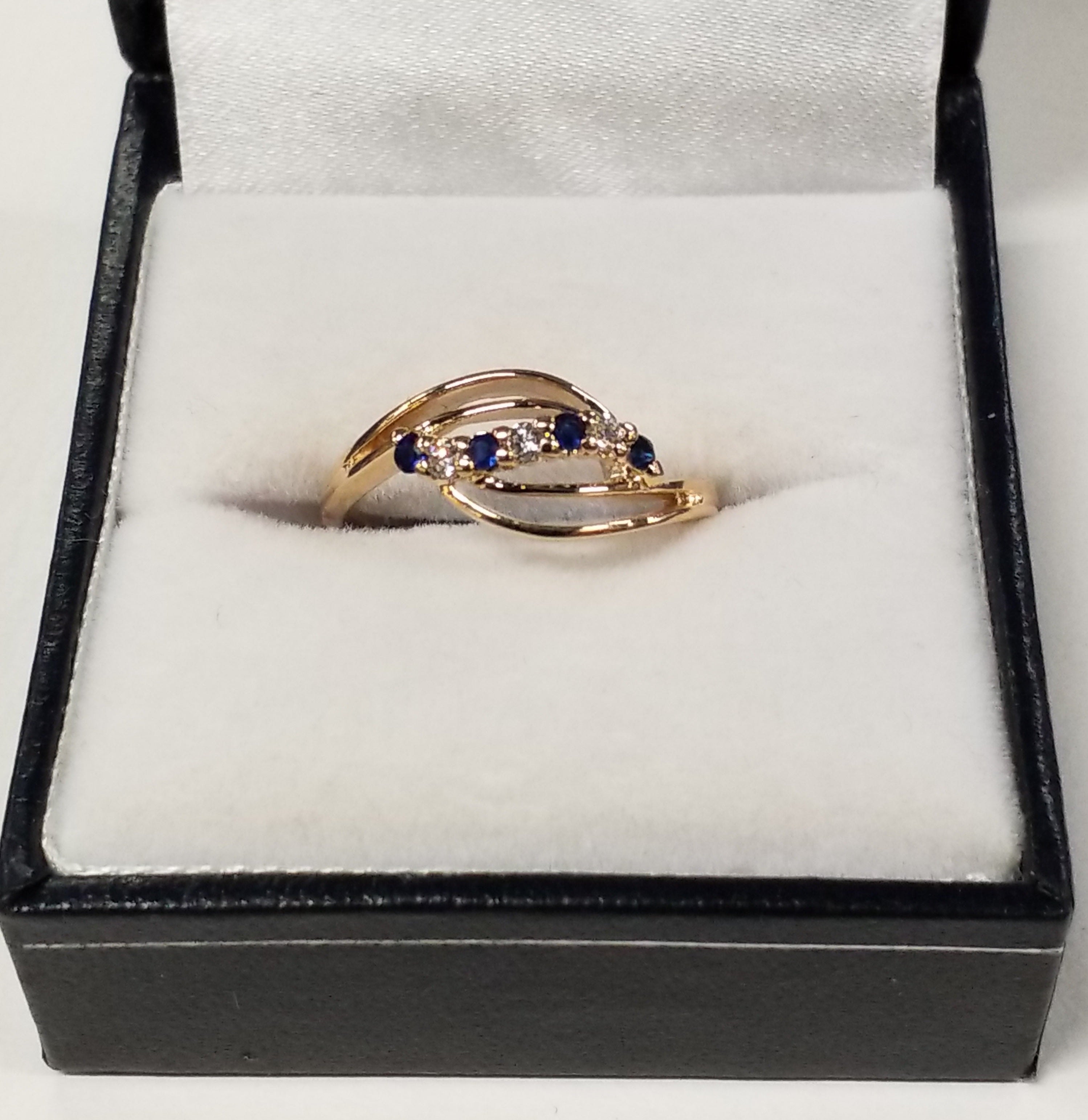 Four Round Cut Blue Sapphire Ring with Diamond Accents