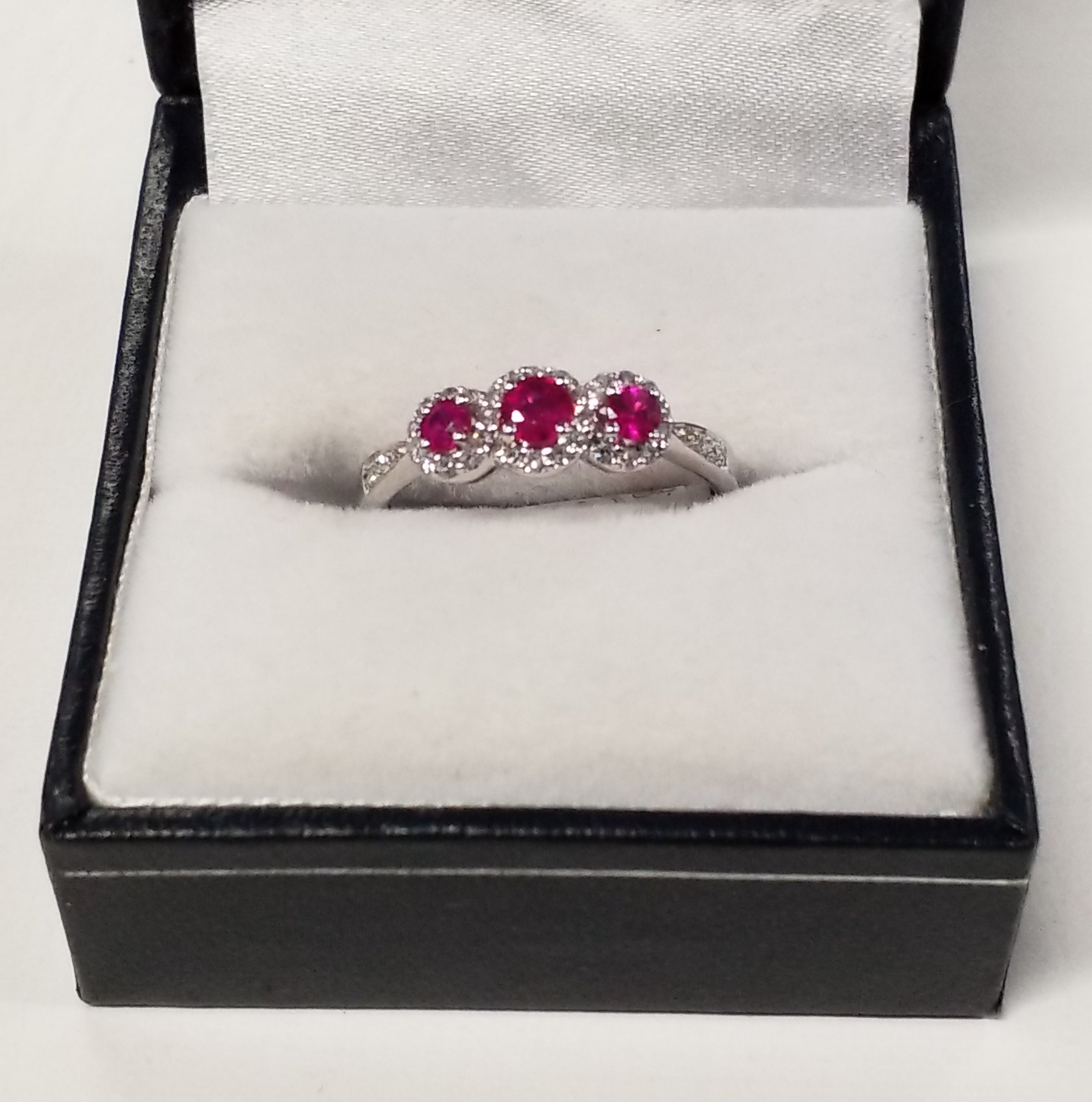 Three Round Cut Ruby Ring with Diamond Accents