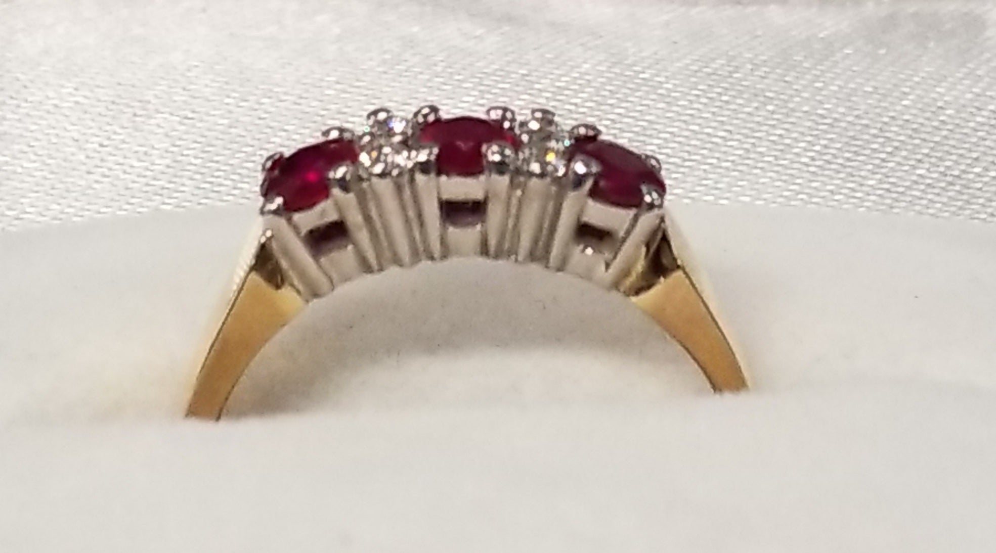Three Round Cut Ruby and Diamond Ring